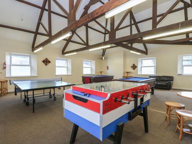 A games room with a foosball table table tennis table and two pool tables at Valley Lodge 38 in St Ann's Chapel Cornwall