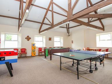 A game room with a ping pong table pool table foosball table and chairs at Valley Lodge 3 in St Ann's Chapel Cornwall
