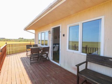 An outdoor space with seating and table at Boa Vista in Bacton