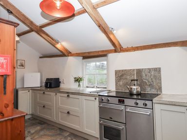 A kitchen with appliances at Westacombe Farm in Dunsford