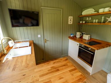 A kitchen with a sink and appliances at Primrose in Grimsby