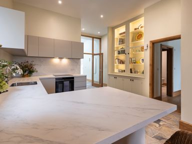 A kitchen with modern cabinetry and shelving at Trevean in Mullion