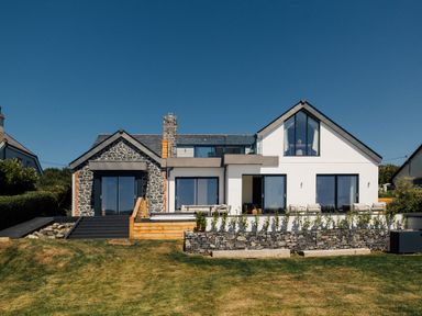 A house with stone features and large windows at Trevean in Mullion