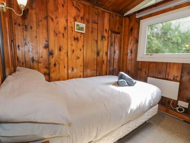 A bedroom with a bed and window at Ty Bedwen in Dinas Mawddwy