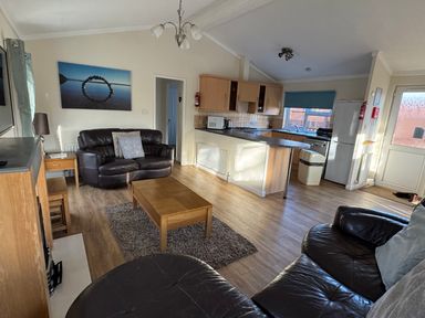 A living room with a sofa and coffee table at Woodland View 31 - The Hawthorns near Chudleigh