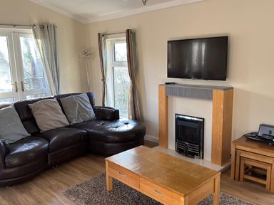 A living room with a sofa and coffee table at Woodland View 31 - The Hawthorns near Chudleigh