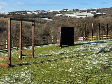 An outdoor area with climbing frames and wall at Woodland View 31 - The Hawthorns near Chudleigh