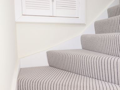 A staircase with a window at Glendale in Port Isaac
