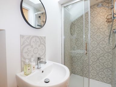 A bathroom with a sink and shower at Glendale in Port Isaac