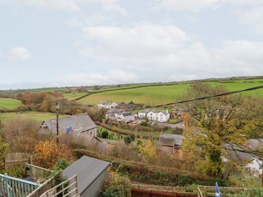 A rural view with houses and fields at Golygfa in Pandy Tudur near Llanrwst