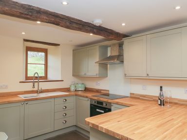 A kitchen with sink and cabinets at Howgill Head in Kendal