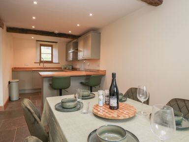A kitchen with dining area located at Howgill Head in Kendal