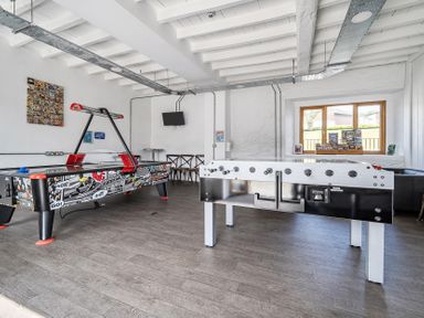 A game room with an air hockey table and foosball table at Harcombe House Rooms Accessible Ground Floor Twin Chudleigh