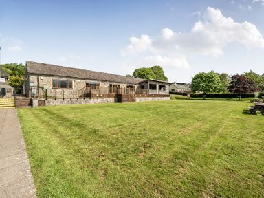 An outdoor view of a building with a lawn at Harcombe House Rooms - First Floor Twin, Chudleigh