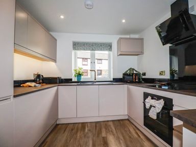A kitchen with cabinets and a sink at Tiddlywink near Indian Queens
