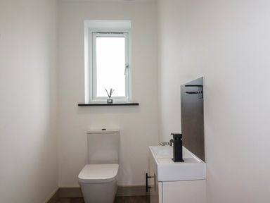 A bathroom with a sink and toilet at Tiddlywink near Indian Queens