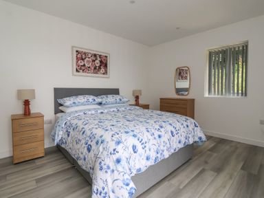 A bedroom with a bed and bedside tables at Castle View in Scarborough
