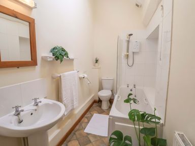 A bathroom with shower and bathtub at Beechwood in Wood Norton