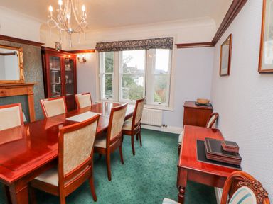 A dining room with a table and chairs at High Cross in Keswick