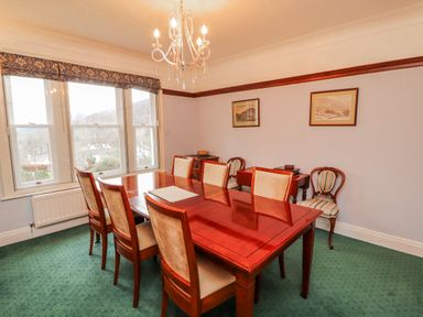A dining room with a table and chairs at High Cross in Keswick