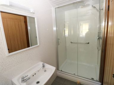 A bathroom with a sink and shower at Dolcoed Manordeilo near Llangadog