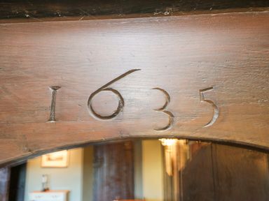Wooden beam with the numbers 1635 carved into it at White Haywood Farmhouse & Barn in Craswall