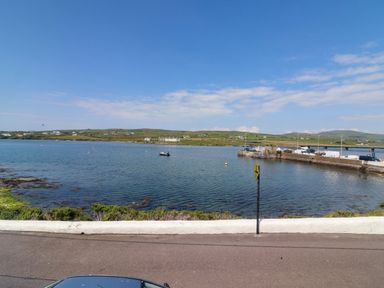 A view of the sea with a boat at O'Conells in Portmagee