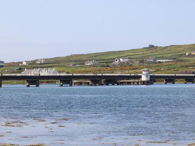 A view of a bridge with nearby houses at O'Conells in Portmagee