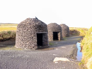 Three stone huts near a water stream in Portmagee