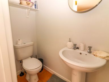 A bathroom with a toilet and sink at O'Connell's Lodge in Portmagee, County Kerry
