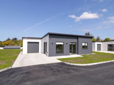 A modern house with a garage and driveway at Number 2 Villa - The View in Derrybeg County Donegal