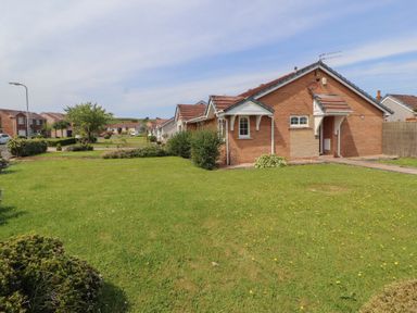 A house with a garden and pathway at 3 Hawk Place near Moresby Parks near Whitehaven