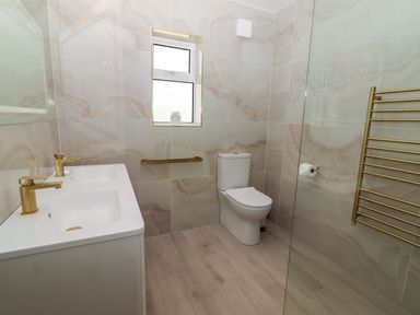 A bathroom with a sink and toilet at Teach Ti in Miltown Malbay