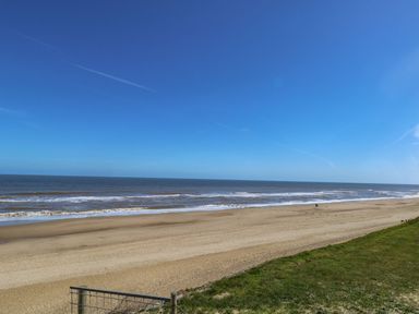 A beach with sand and ocean at Life's a Beach in Bacton
