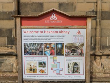 An information board welcoming visitors to Hexham Abbey with details about history services and facilities at Hexham Abbey Riding Mill near Corbridge