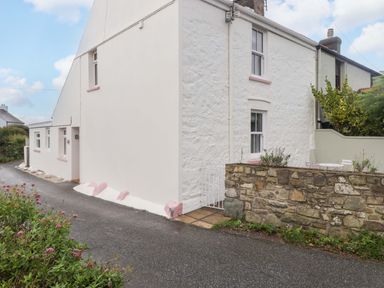 An exterior view of a house with a garden at Penwyn Solva