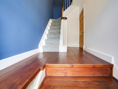 A staircase in a hallway at Church Hill House in Port Isaac