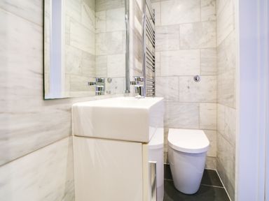 A bathroom featuring a sink and toilet at Church Hill House, Port Isaac