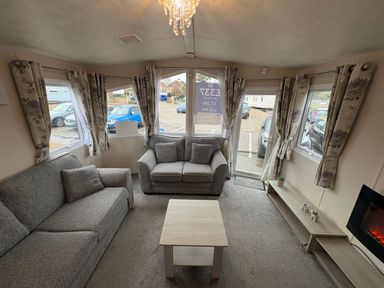 A living room with a sofa and coffee table at Caravan 941 Clacton-On-Sea