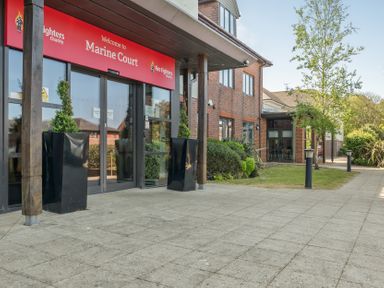 An outdoor area with an entrance to Marine Court at Littlehampton