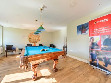A game room with a pool table and seating area at Marine Court First Floor Double with Shower Room Littlehampton