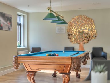 A game room with a pool table and chairs at Marine Court First Floor Double with Shower Room Littlehampton