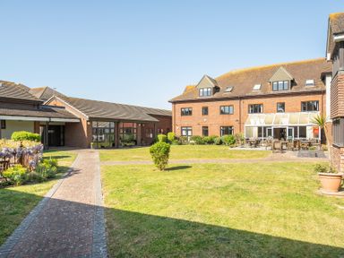 An outdoor area with buildings and a courtyard at Marine Court First-floor Double Bedroom with Wet Room in Littlehampton