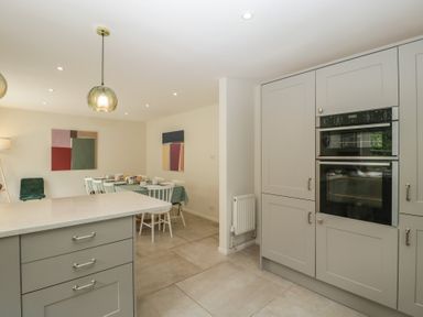 A kitchen with dining area and modern features at St. Marys House Church Westcote near Bledington