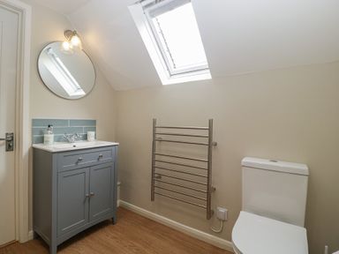 A bathroom with a sink and mirror at St. Marys House in Church Westcote near Bledington