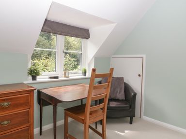 An office with a desk and a chair at St. Marys House, Church Westcote near Bledington