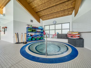 A hot tub with shelves of equipment at Jubilee First-floor Double Bedroom in Penrith