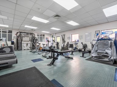 A gym with various exercise equipment at Jubilee First-floor Double Bedroom Penrith