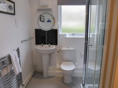 A bathroom with sink and shower at Bungalow 15 Eamont Park in Penrith