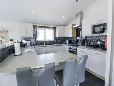 A kitchen with appliances and countertop at Number 42 Wemyss Bay